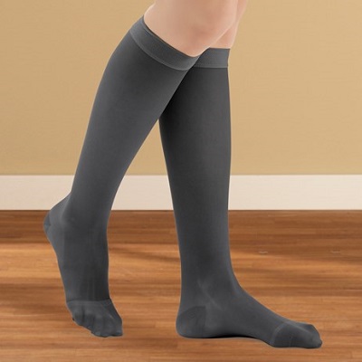 person wearing black compression socks