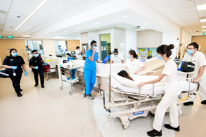 hospital corridor with various healthcare providers wearing knee high hoses