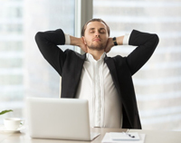 picture-of-man-relaxing-with-hands-behind-neck-sitting-on-chair-in-office