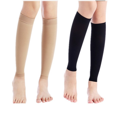 20 - 30 mmhg multi color knee high compression socks wore by a pregnant woman