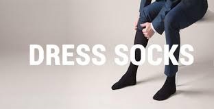 person putting on socks before going to work