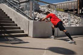 person stretching after a run in sports wear