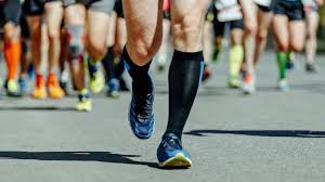 people running in marathon in sports shoes