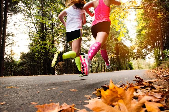 Atheletes in pressure socks during an intense morning workout session