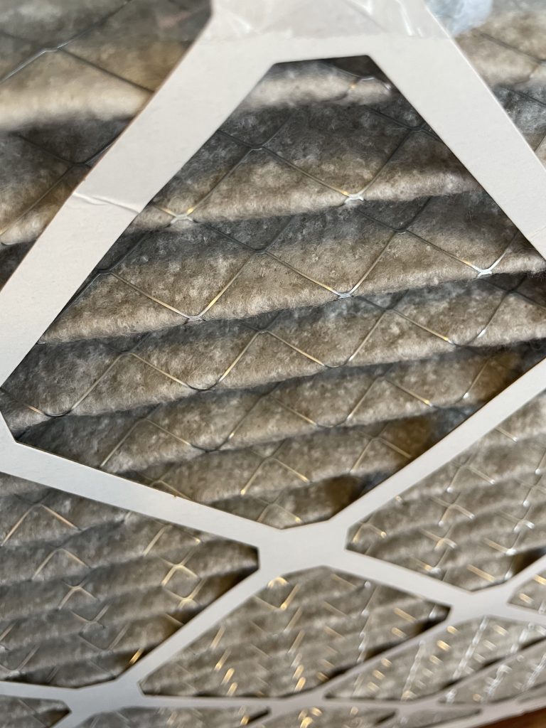 Image of a filter media with black marks from an activated carbon (often called charcoal) filter before the filter media shown. The activated carbon has left it's position on the charcoal filter media, turned into dust, and deposited itself on the final filter media. This is the reason Coconut Air uses 2 HEPA filters. The second HEPA filter captures airborne particles from the activated carbon filter. Other brands like IQair Atem, GoPure, Nuvomed, and Philips don't have this second filter. None of the ion or ozone generator models have any filters. Many budget air purifiers simply don't work. Even the high end air purifiers don't include this second filter for budget reasons.