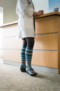 A nurse wearing compression hosiery