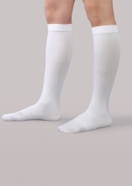  A man wearing knee-high white anti-thrombosis stockings