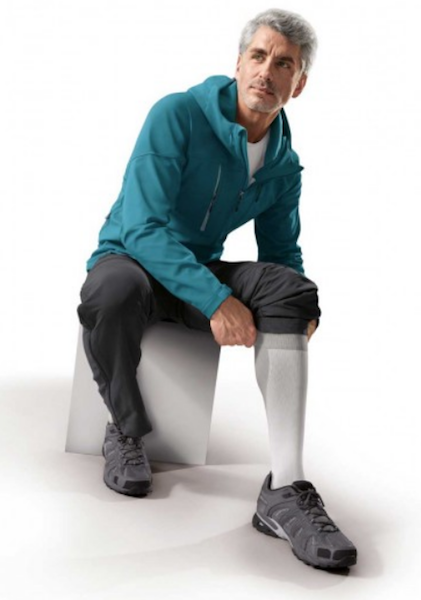 man wearing a pair of gray men's compressions socks/support socks of 20-30 mmHg
