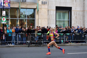 Knee high compression stockings help athletes be competitive by delivering oxygen to muscles and reducing lactic acid build up. Shalane Flannagan is seen running the 2013 Boston Marathon in knee high compression stockings.