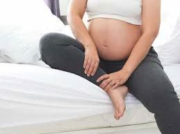 An image of a pregnant woman in need of compression stockings