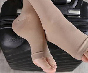 Toeless flight socks worn by traveller  or tourist cross legs on luggage