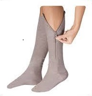 A person wearing compression socks with zippers