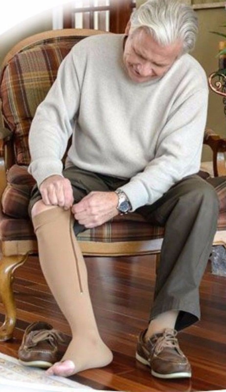 Image showing an old man wearing zippered compression socks