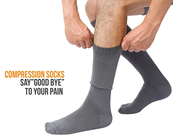 person putting on knee high compression socks