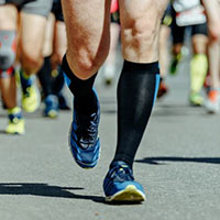 athletes wearing running compression socks