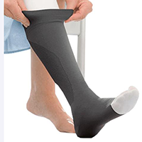 wearing compression socks to treat venous insufficiency