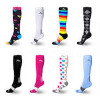 Several more compression socks designs. Colored hearts on a black stocking, plain white stocking with a single grey stripe, multicolored rainbow stripes, black and white tux design, black and pink stockings each with a white s tripe, a white stocking with bright pink , blue and orange spots, and lastly a light blue stocking with a grey stripe.