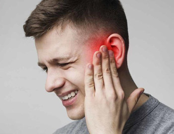 Man experiencing ear infection