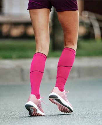 Woman Running with the Best Compression Socks On