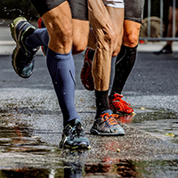 Runners wearing knee high Compression Socks