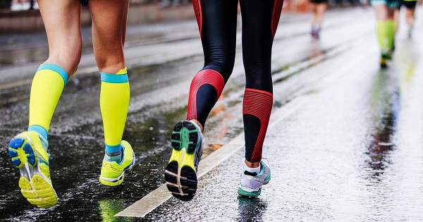 Image showing two people running while wearing compression socks