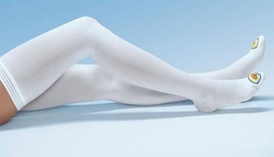 image of a woman sleeping with anti embolism stockings