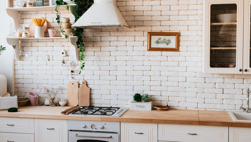 kitchen with brick wall 