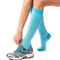athlete wearing knee high compression socks