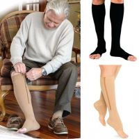 A man putting on zip-up socks