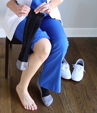 nurse wearing black compression socks