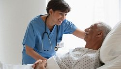 nurse assisting a patient in hospital