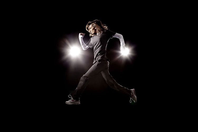 image showing a nurse running while wearing compression sleeves and socks