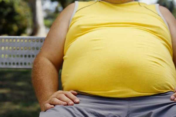 Man with obesity in yellow t-shirt