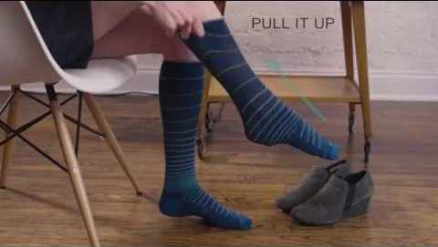 a lady pulling up socks