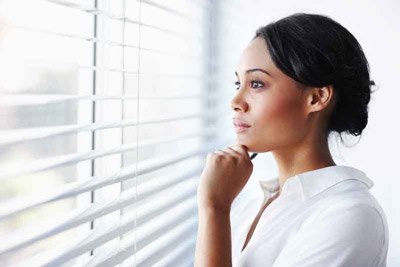 Woman thinking about the best compression socks for edema