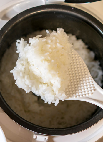 a serving of rice being scooped