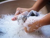 woman washing compression socks