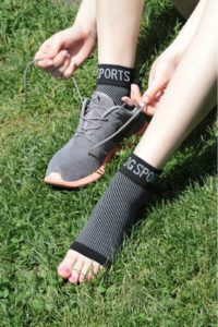 image showing a sports person wearing ankle socks for compression