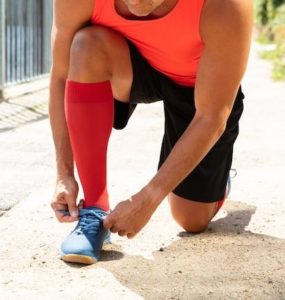 image of a runner wearing compression socks