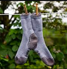 image of socks drying outdoors on a clothesline