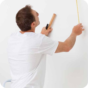 Man Measuring the wall