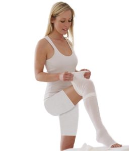 image of a lady wearing white anti embolism legwear