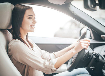 Picture of a smiling woman driving a car. Dedicated vehicle air purifiers are required for filtering dust, viruses, bacteria, smoke, mold, odors, pollen, smell, allergens, pet dander, airborne debris, pollution, and asthma triggers. Common brands are IQair Atem, Nuvomed, Gopure, and Phillips. We recommend the Coconut Air CocoCube Car Air Purifier. It's a premium product and not a budget brand. The CocoCube has 2 HEPA filters with a 12.80 mm Activated Carbon filter in between. It plugs into your usb ports and is completely silent. Having a dedicated plug-in car air filter is important now more than ever.