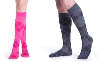 two people wearing pink and grey comression socks