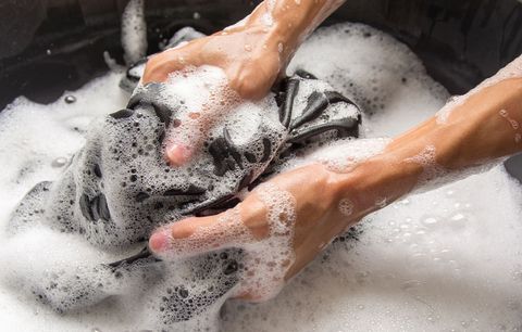 Image showing a person washing compression socks